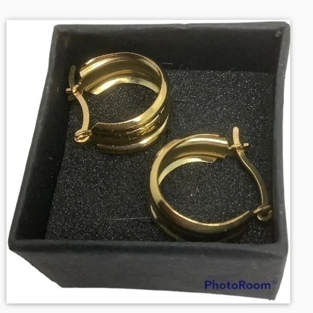 - Gold over sterling silver huggie earrings